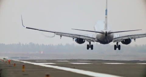 Slow motion video of the plane landing on the runway. Stock Footage 245978778