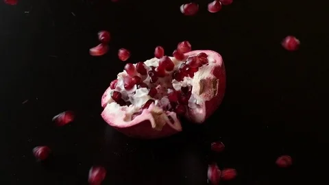 Slow motion video of a pomegranate that is falling down Stock Footage 111235629