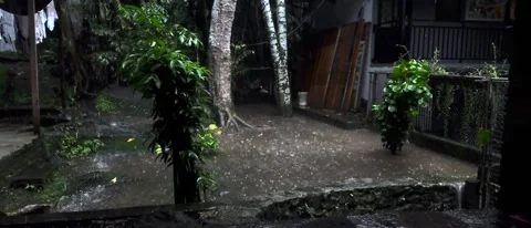 Slow motion video, Rainfall Over a Quiet Backyard at Night Video stock 303916430