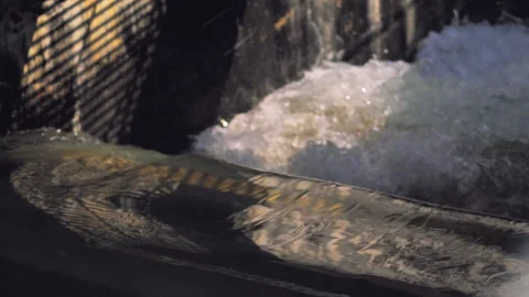 Slow-motion video of rapid water flow in a dam. Stock Footage 132774726