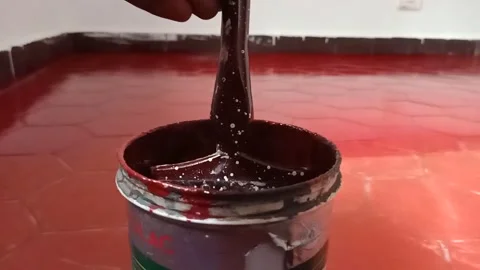 Slow motion video red floor tile paint dropping from brush Stock Footage 149507740