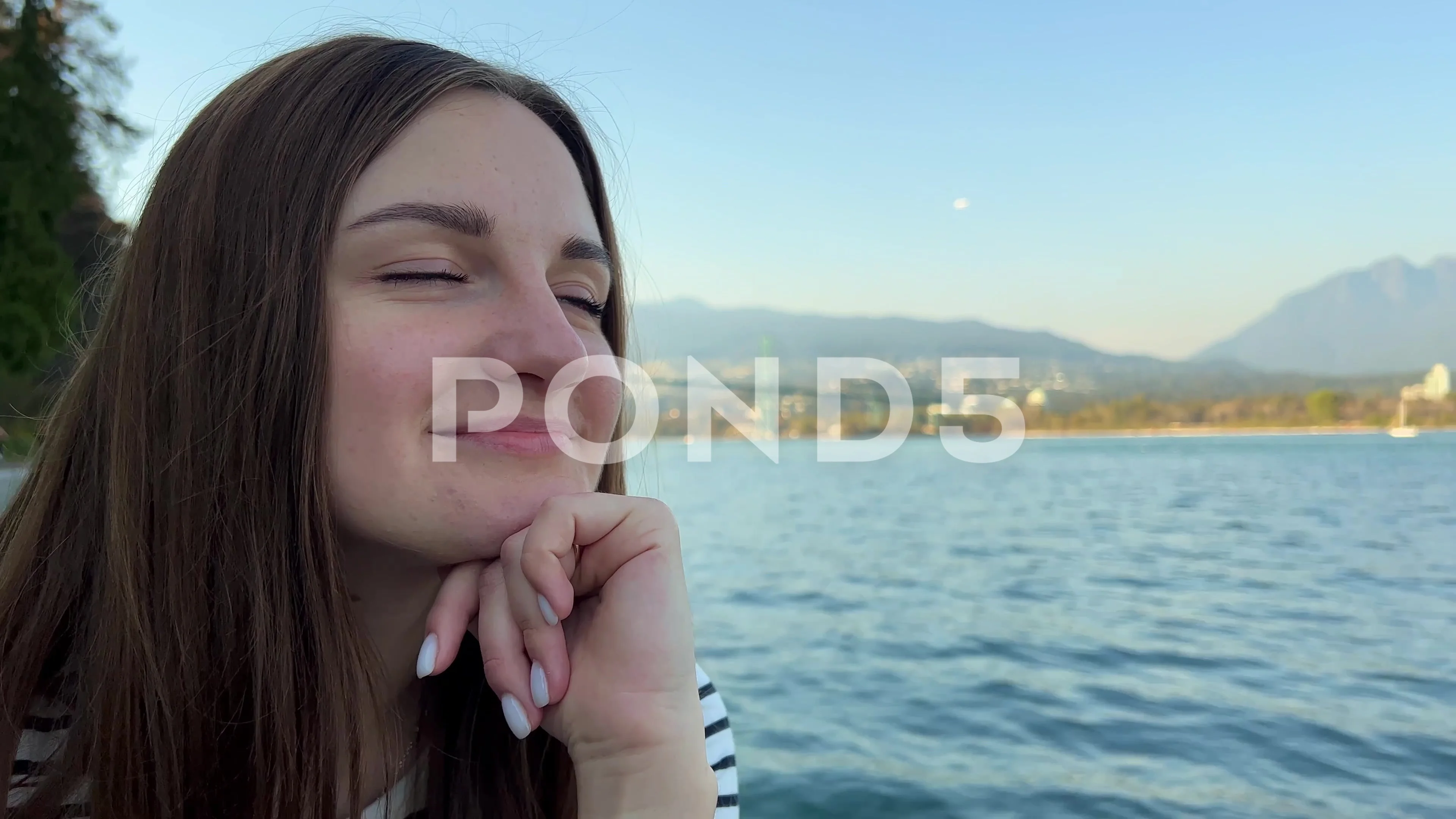 Slow Motion Video Romance A young girl sits on the shore of the Pacific  Ocean