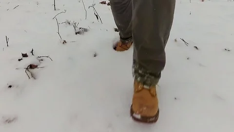 Slow motion video of running man on snow. Stock Footage 70621136