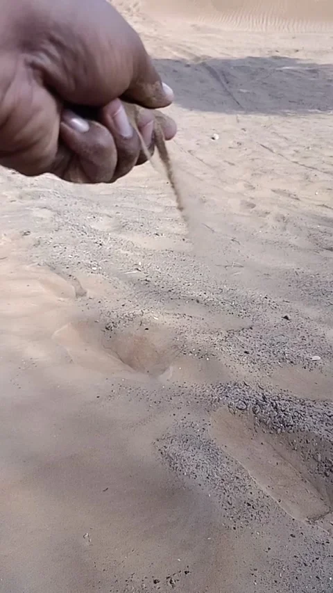 Slow motion video of sand pouring Stock Footage 160636099