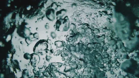 Slow motion video of scuba diver releasing air during the dive. Stock Footage 188231310