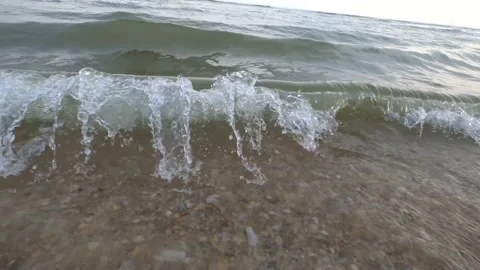 Slow motion video of a sea wave crashing to shore Stock Footage 166304912
