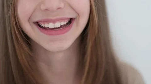Slow motion video with a smiling little girl with a long hair Stock Footage 228699650