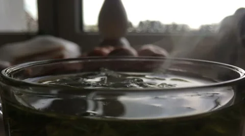 Slow motion video of steam moving over mint tea glass Stock Footage 60224908