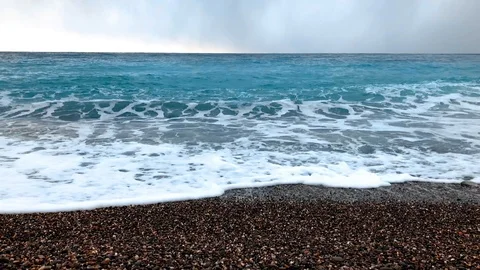 Slow motion video of stone beach with small waves Video stock 90553405