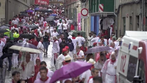 Slow motion video with thousands of people gathered in the streets of Pamplona Stock Footage 237707943