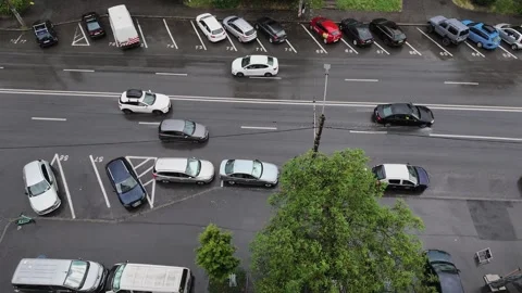 Slow Motion Video of Traffic Moving Through Rain on Street Today Stock-Footage 340165388