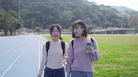 A slow-motion video of two young Taiwanese women Видео 279292868