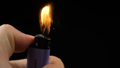 Slow Motion Video of Using a Lighter at Night with Sparkles and Fire Stock Footage 109489514