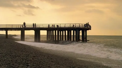 Slow motion video. View of the pier from the side on the seashore. Stock Footage 221279227
