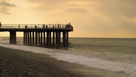 Slow motion video. View of the pier from the side on the seashore. Stock Footage 221279685