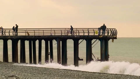 Slow motion video. View of the pier from the side on the seashore. Stock Footage 221281235