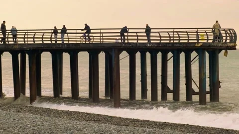 Slow motion video. View of the pier from the side on the seashore. Stock Footage 221289148