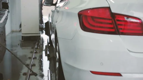 Slow motion video of a washing process on a self-service car wash. Automobile Stock Footage 129303531