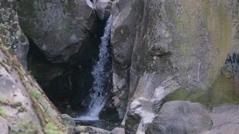 Slow motion video of water flow through the rock and stones. Stock Footage 198651003