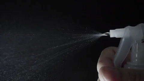 Slow motion video of water sprayed and cleanser spray by hand Stock Footage 83944934