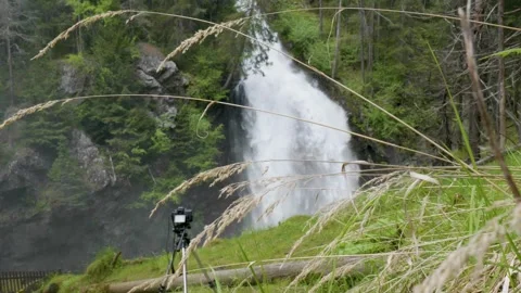 Slow motion video of a waterfall and a camera Video stock 242022293