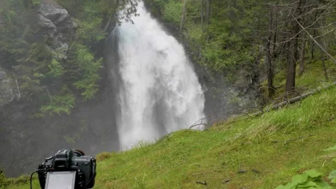 Slow motion video of a waterfall and a camera Video stock 242022295