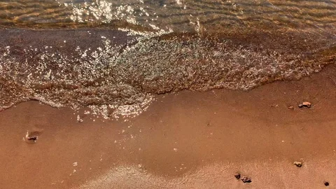 Slow motion video of waves running onto the beach Stock-Footage 115696477