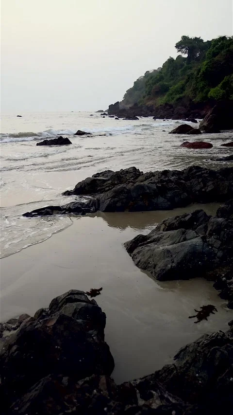 Slow motion video of waves at sunset on the beach Video stock 329059078