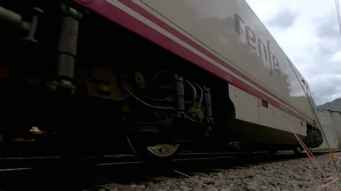 Slow-motion video of the wheels of an Alvia high-speed train of Renfe - Operator Stock Footage 313806740