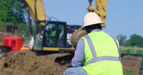 Slow Motion Video of Worker Watching Tractors Stock Footage 201157567