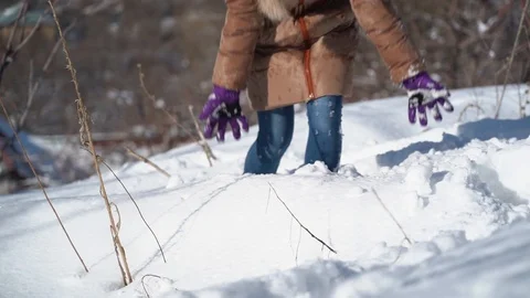 Slow motion video. A young cheerful girl with blond hair in the mountains, in wi Stock Footage 101243539