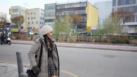 Slow-motion video of a young Filipino woman in her 20s walking in Seoul Stock Footage 265880098