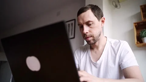 Slow motion video. Young man using laptop. Guy hands typing at computer keyboard Stock Footage 202182563