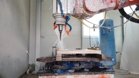 Slow motion view of 3D robotic milling cell sculpting stone Stock Footage 329216156