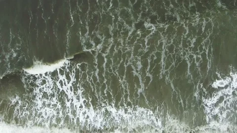 Slow-motion view from above raging sea surf Stock Footage 132181980