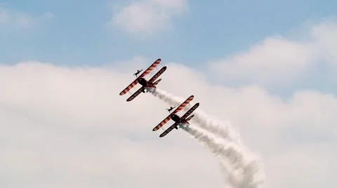 Slow motion view of acrobatic airplanes at an air show Stock Footage 68580384