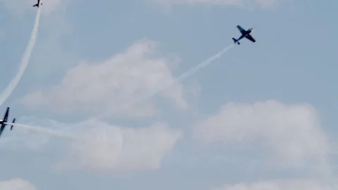 Slow motion view of acrobatic airplanes in formation at an air show Stock Footage 79935198
