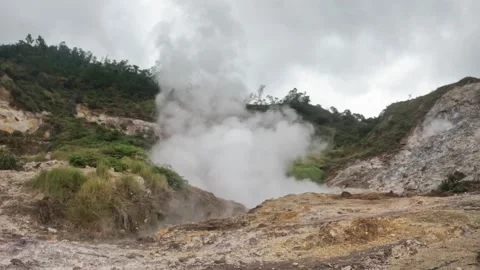 Slow motion view of an active crater spewing white hot steam Stock Footage 319907140