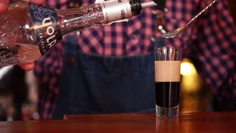 Slow motion view on bartending drink mixing preparation process of classic Stock Footage 103804885