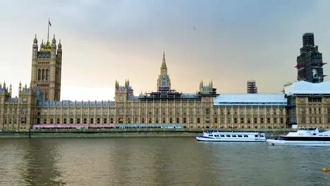 Slow Motion View of Boats on Thames Beside Parliament and Elizabeth Tower in Stock-Footage 321037518