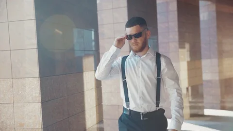Slow motion view of brutal young bearded Caucasian man in formal wear walking Stock Footage 115667265