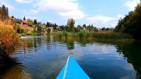 Slow motion view of a canoe on river Mrežnica in Croatia Stock Footage 123381519