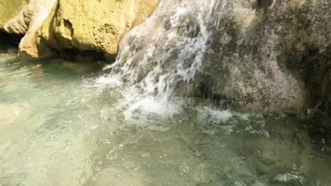 Slow motion view of a clear waterfall with limestone rocks Stock Footage 321321871
