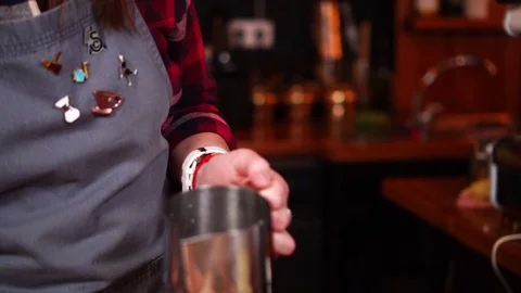 Slow motion view on coffee making process of female barista pouring milk from Stock Footage 104541464