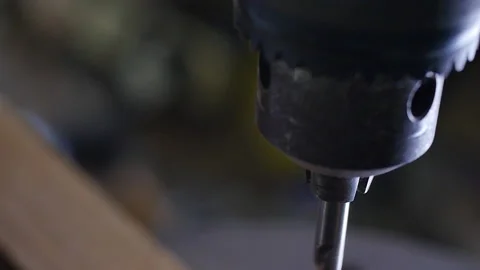 Slow motion view of drill chuck drilling in carpenter wood. handmade wooden Video stock 140976993