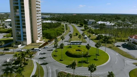 Slow Motion View of East Mall Roundabout Traffic in Freeport, Grand Bahama Stock Footage 106786757