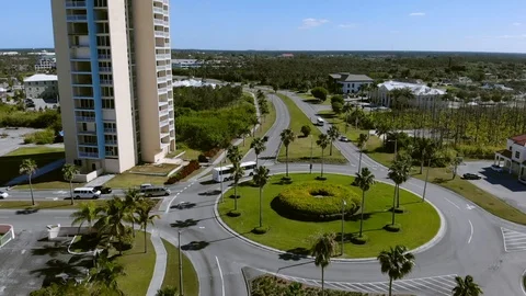 Slow Motion View of East Mall Roundabout Traffic in Freeport, Grand Bahama Stock Footage 106786819