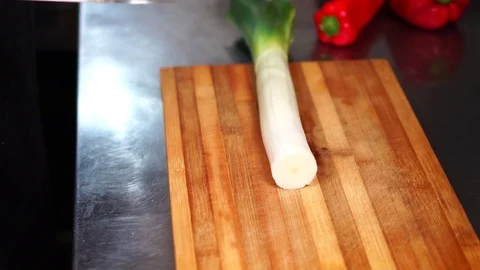 Slow motion view on fresh cut vegetables green onion red pepper hot chili on Stock Footage 105454662
