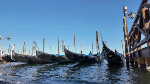 Slow Motion View of Gondolas Moored Along the Grand Canal in Venice, Italy Stock Footage 342605533