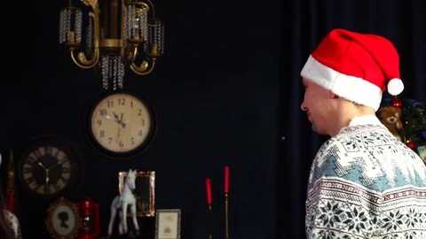Slow motion view on grateful girlfriend cuddle thoughtful boyfriend in Santa hat Stock Footage 98831759